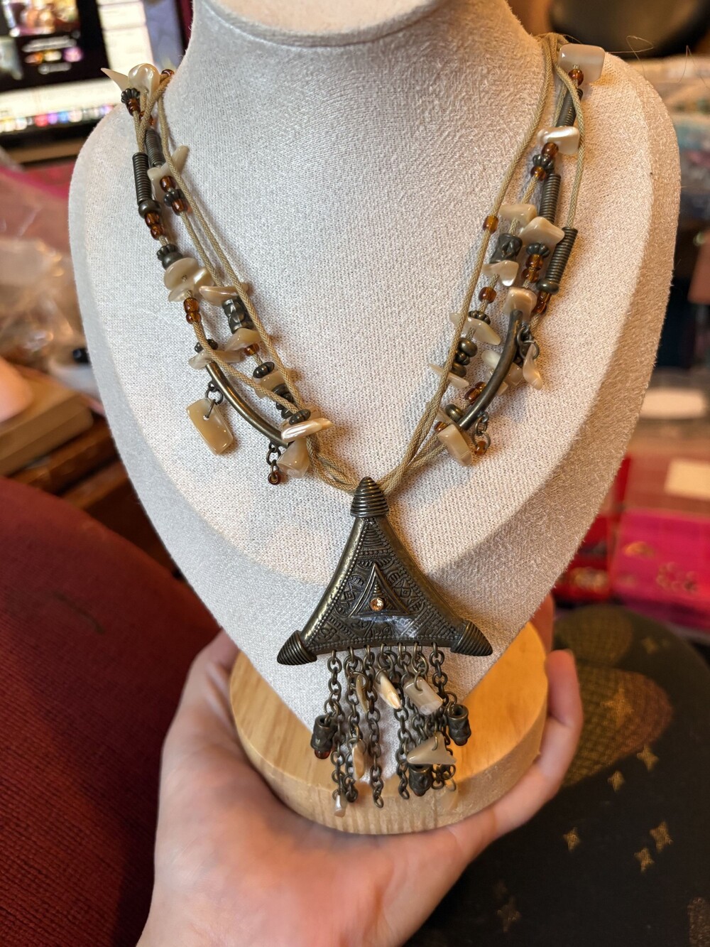 Multi-Strand Tribal Style Necklace with Shell Beads and Metal Pendant